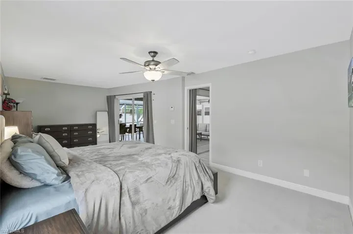 Carpeted interior with light gray wall paint and white trim