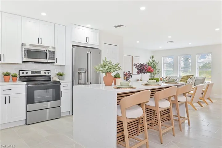 Kitchen with island and waterfall