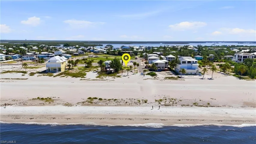 Beachfront property featuring a white sand beach