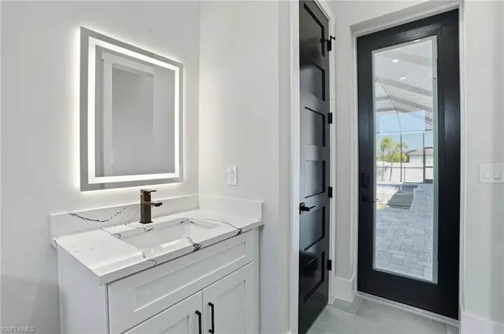 Bathroom featuring vanity and light tile patterned flooring