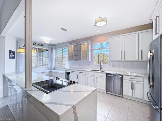 Full kitchen renovation Upgraded cabinetry with high end glass front displays