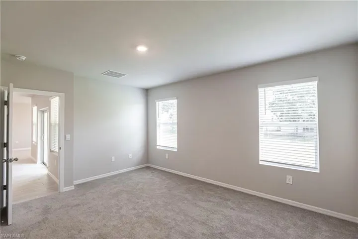 Spare room with light colored carpet