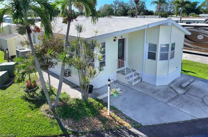 View of front of home with central AC