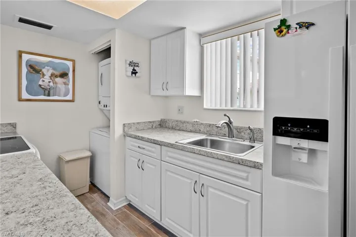 Kitchen. Nice window over the sink for lots of natural light. Updated cabinetry and countertops. Range/oven, washer/dryer, refrigerator with water/ice on the door. All kitchen items are included.