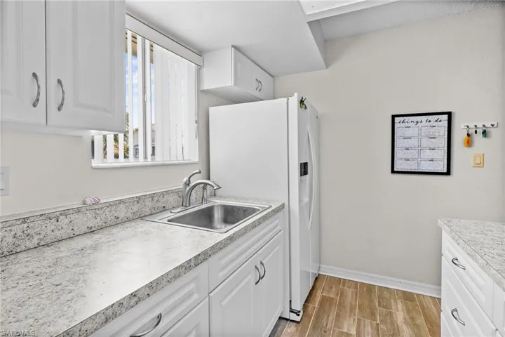 Kitchen. Nice window over the sink for lots of natural light. Updated cabinetry and countertops. Range/oven, washer/dryer, refrigerator with water/ice on the door. All kitchen items are included.
