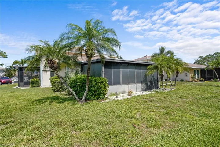 5848 Queen Elizabeth Way Unit #1 - One story, only one shared wall. Pool is just outside door.Large, screened lanai with all-season windows and nicely tiled.