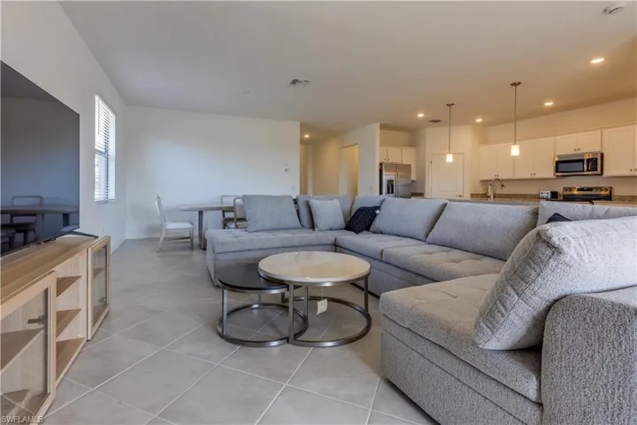 Living area featuring light tile patterned floors