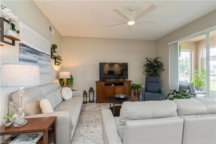 Living room featuring ceiling fan