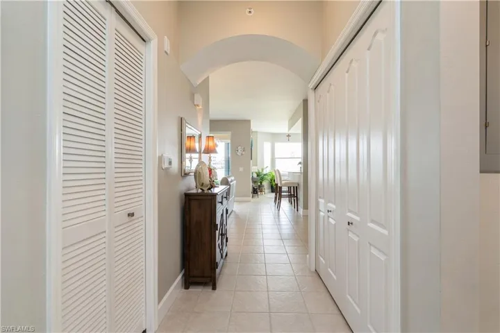 Corridor with light tile patterned flooring