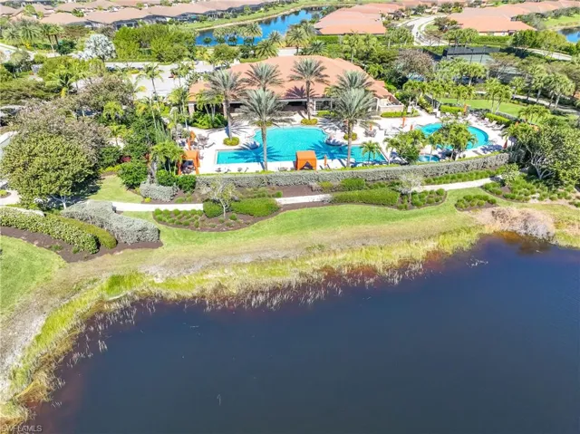 Drone / aerial view of a large body of water and a pool