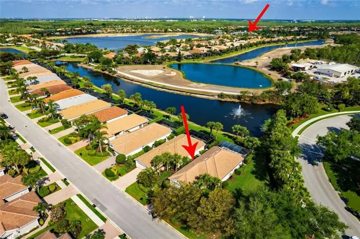 Drone / aerial view featuring a residential view and a water view