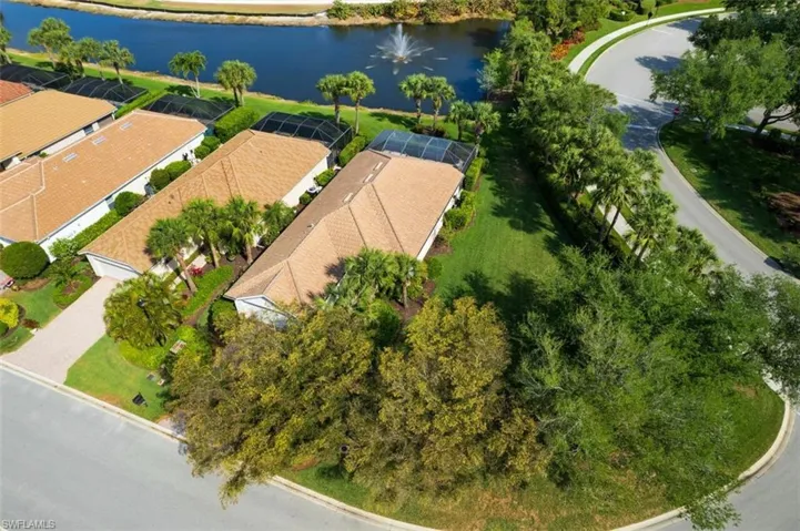 Aerial view featuring a water view and a residential view