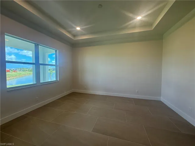 Primary bedroom suite with water view