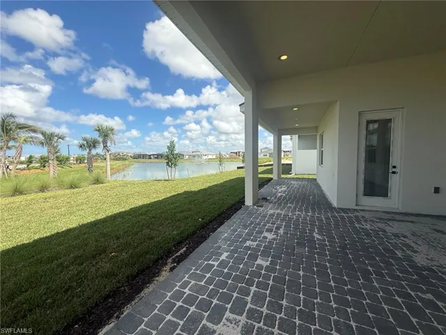 Underneath spacious covered lanai with cabana bathroom