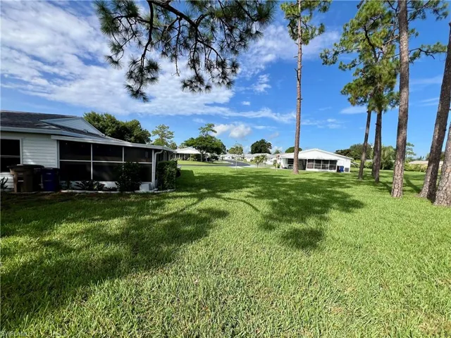 View of yard featuring a sunroom