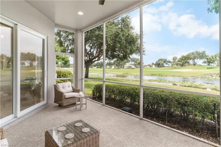 Sunroom / solarium with a water view