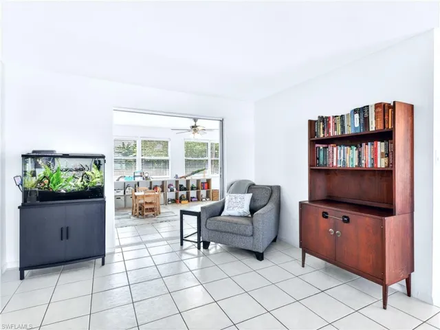 Bright interior space featuring light tile flooring and white walls