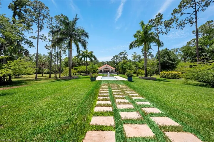 Main house Lanai faces pool, fountain water feature and guest house, creating synergy