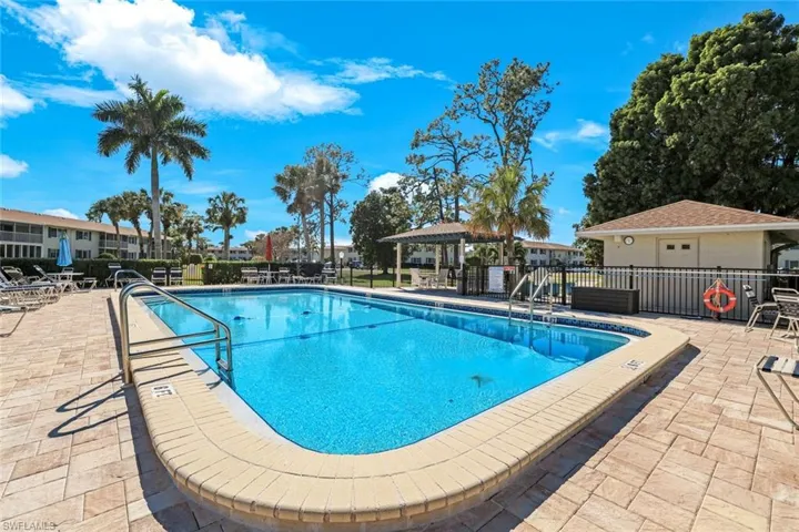 Community pool with a patio and a gazebo