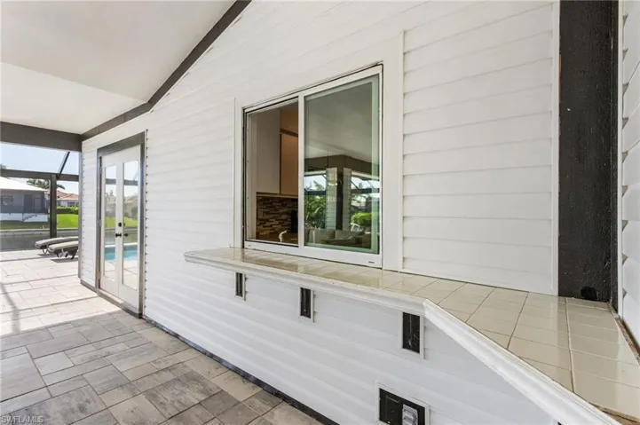 Pass-through from kitchen to patio serving bar
