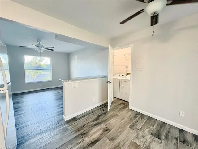 Lower unit looking from kitchen into living and laundry room