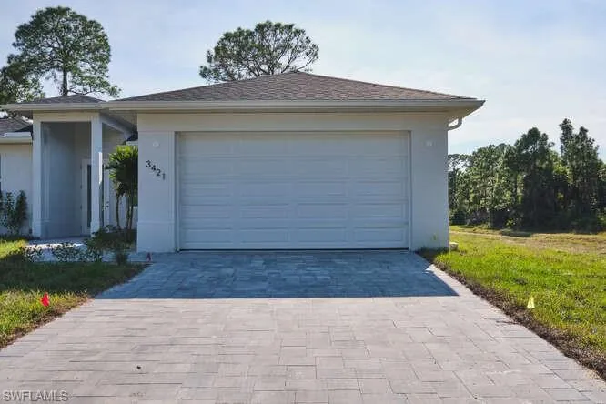 Garage with decorative driveway