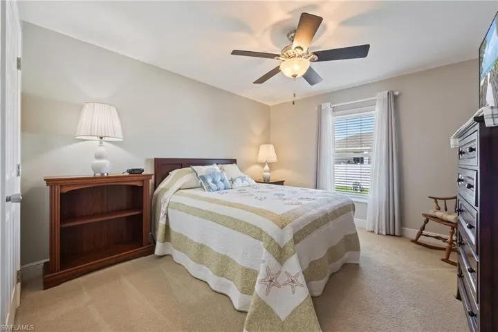 The 3rd bedroom features a window with blinds, carpeted flooring, and a ceiling fan with integrated lighting