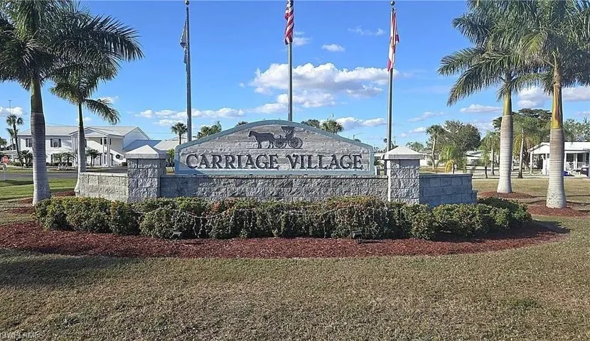 Community sign featuring a lawn