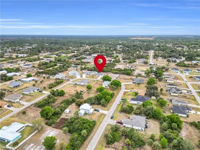 View of property location with nearby suburban area