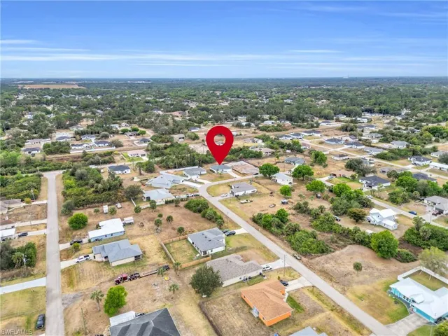 View of property location with nearby suburban area