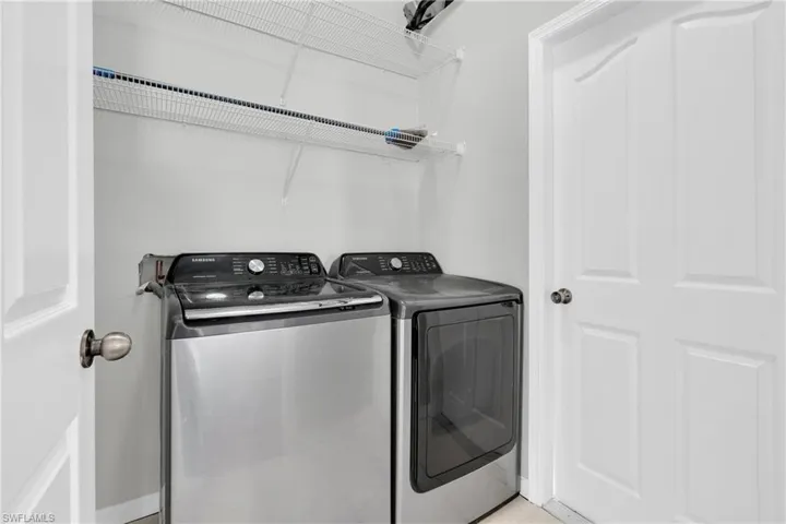 Laundry room with washing machine and dryer