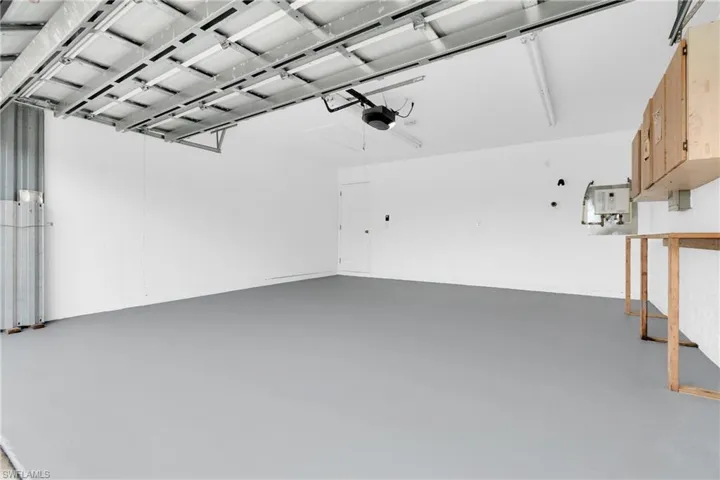 Garage featuring a garage door opener
