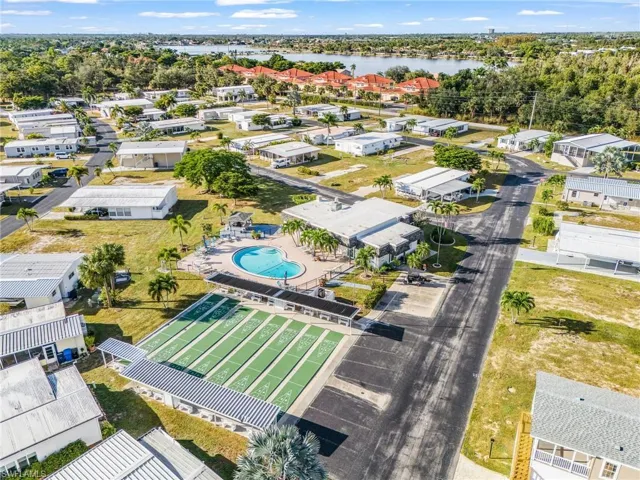 Community amenities featuring a swimming pool, shuffleboard courts, and a clubhouse