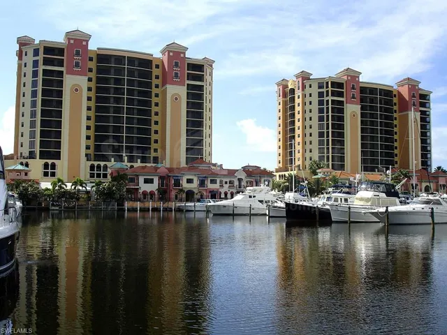 View of property with a water view