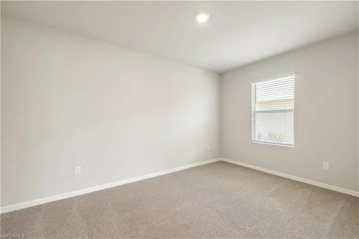 Unfurnished room featuring carpet flooring