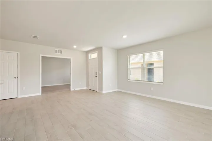 Empty room with light wood-type flooring
