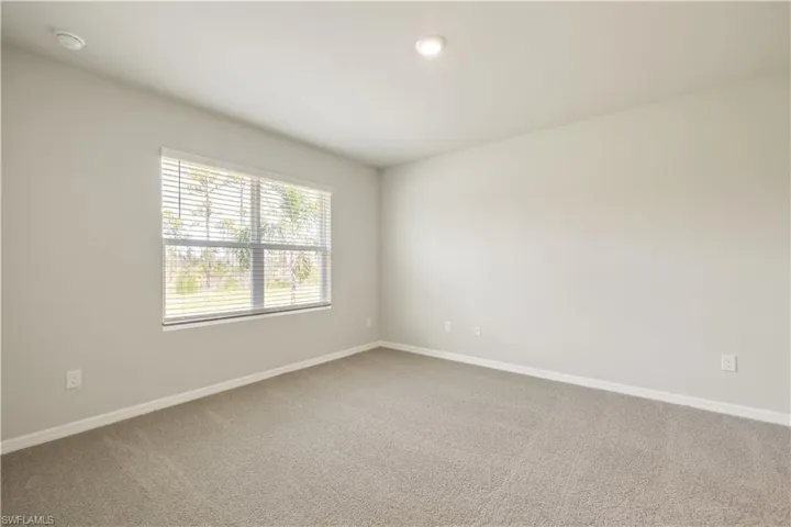 Empty room with carpet floors