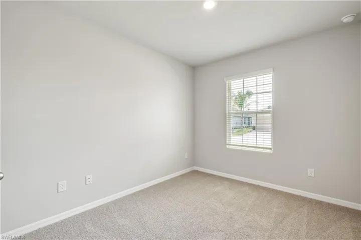 Empty room featuring carpet flooring