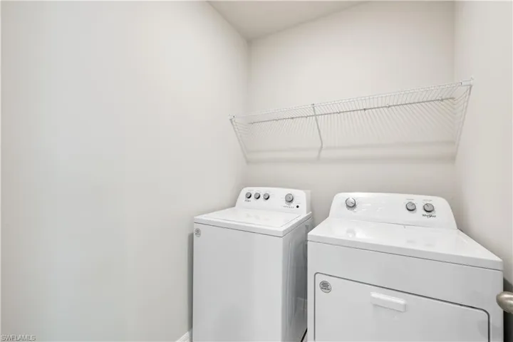 Laundry room featuring separate washer and dryer