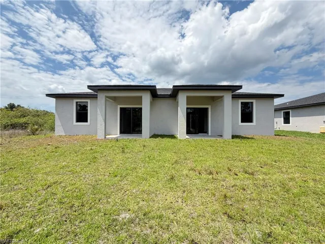 1256  MILWAUKEE  BLVD, Lehigh Acres, FL 33974