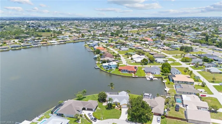 Waterfront property featuring a private boat dock and direct canal access