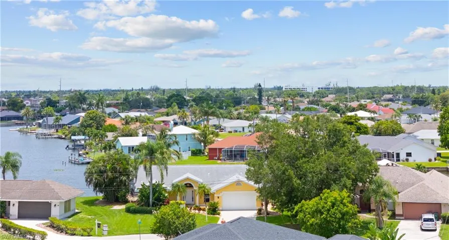 Residential neighborhood featuring a canal with boat docks