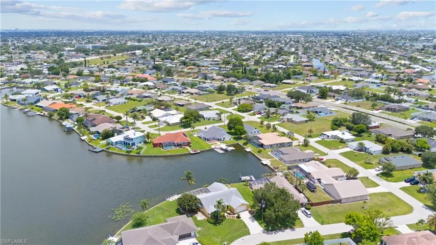 Extensive network of residential canals offering direct water access, surrounded by single-story homes with varied roofing styles and mature landscaping