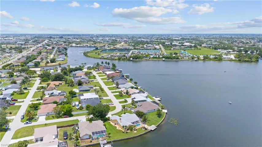 Waterfront properties featuring private docks and mature landscaping