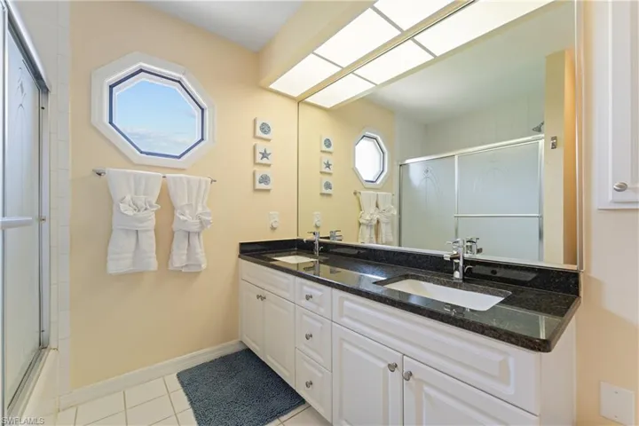 Dual vanity with granite countertop and integrated sinks