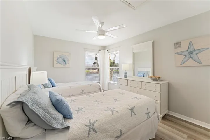 White walls complement wood-finish flooring in this bright room