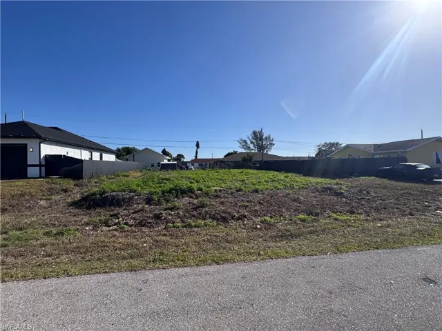 Expansive vacant lot featuring a cleared building envelope and street frontage