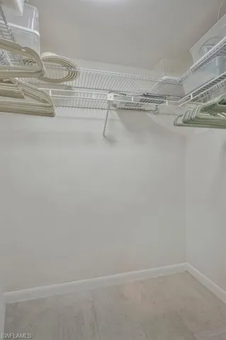 The primary bedroom's walk in closet.