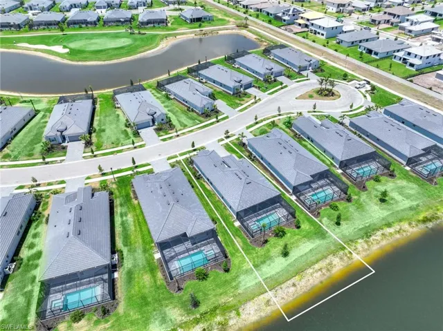 Aerial view with a water view and a residential view