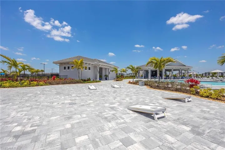 View of property's community featuring fence, a swimming pool, and a patio